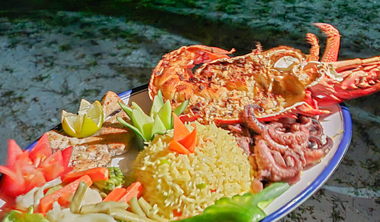 Grilled lobster and rice seafood meal in Addu Atoll Maldives